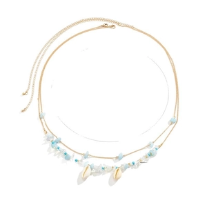 Boho Taillenkette in Gold mit blauen Steinen und natürlichen Muscheln für den Sommerstrand