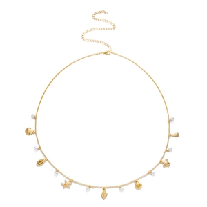 Detail of gold beach waist chain with starfish, shell pendants and white pearls