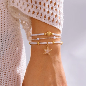 Bohemian multilayer bead bracelet set with gold seashell and pink starfish charms