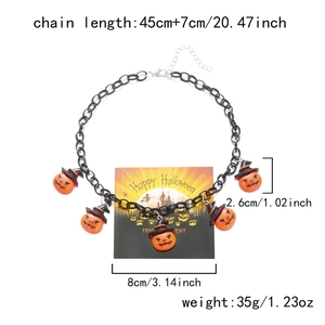 Halloween necklace detail showing five orange pumpkin pendants with black wizard hats