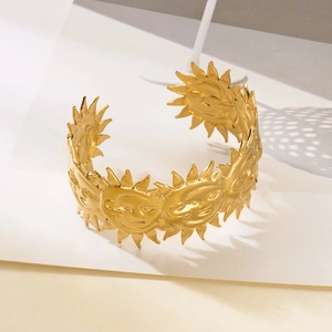 Bohemian gold sun face embossed open cuff bracelet with a vintage matte finish