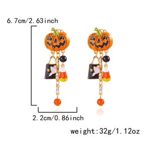 Halloween oorbellen detail met pompoen lach en spookhangers met kwastjes