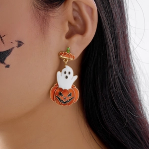 Detail of pumpkin and ghost Halloween earrings with crystal leaf and drip oil finish