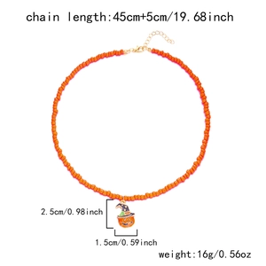 Detail of beaded necklace with pumpkin charm and specifications for length and weight