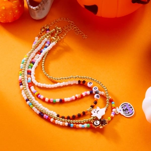 Detail view of colorful Halloween beaded necklace with ghost pumpkin and BOO charms