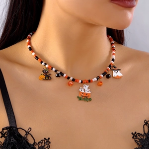 Close-up of beaded Halloween necklace with Wicked pumpkin, black cat, and ghost charms