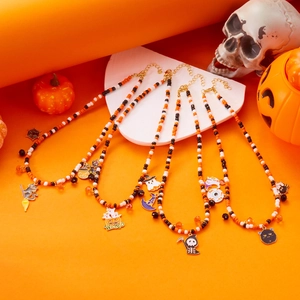 Halloween beaded necklaces with pumpkin, ghost, and spider charms in orange black and white