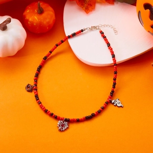 Detailed view of Halloween beaded necklace with spider web heart and ghost charms
