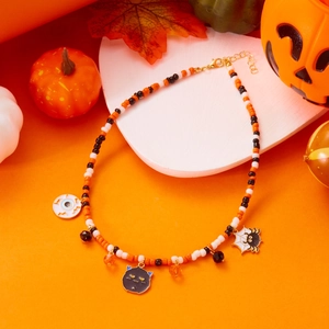 Halloween beaded necklace with pumpkin colors featuring ghost and spider web pendants