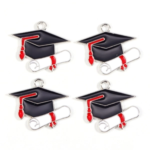 Detailed view of alloy enamel graduation charms featuring mortarboard and diploma designs