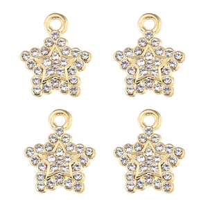 Vue macro de quatre pendentifs en forme d'étoile dorée avec des strass blancs étincelants