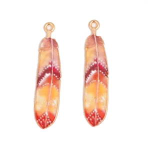 Pair of colorful feather pendants with orange gradient and white dotted patterns