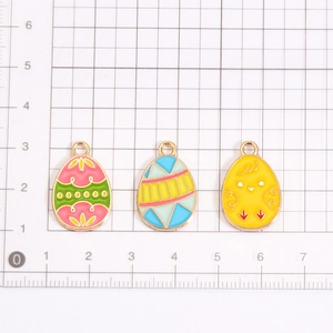 Colorful Easter egg charms in pink, green, and yellow alloy for DIY jewelry making