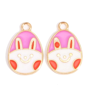 Detail of colorful cartoon Easter egg pendants with pink enamel and golden finish