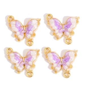 Détail de quatre breloques papillon dégradé violet avec boucles dorées pour bijoux DIY