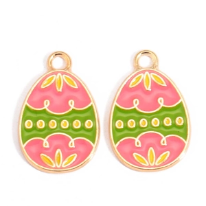 Detail of enamel Easter egg charms with colorful patterns and golden metal borders