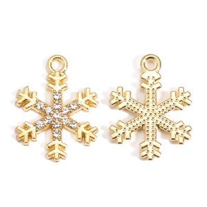 Detail of snowflake pendant with clear rhinestones and golden plating for DIY jewelry