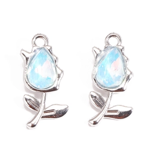 Detailed view of silver tulip pendant with light blue teardrop-shaped zircon for DIY jewelry