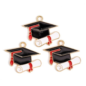 Detail of alloy graduation charms featuring black mortarboard and diploma with red tassel