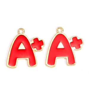 Detail of red enamel A+ charm in gold alloy for graduation jewelry making accessories
