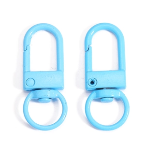Detail of two sky blue metal swivel lobster clasps for keychains and bag accessories