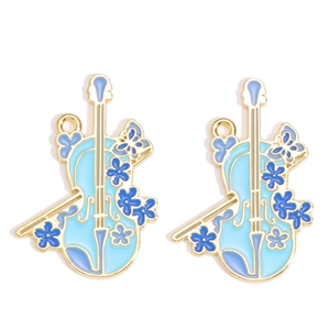 Detail of blue violin charms with floral patterns for jewelry making DIY accessories