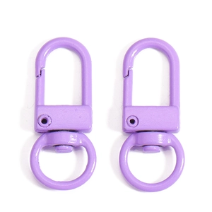 Close-up of purple swivel lobster clasps for DIY bag accessories and keychains