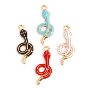 DIY snake charm set with colorful enamel finish in blue, black, white, and red for jewelry