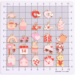 Set of 20 Valentine's Day alloy charms featuring love hearts, envelopes, and pink icons
