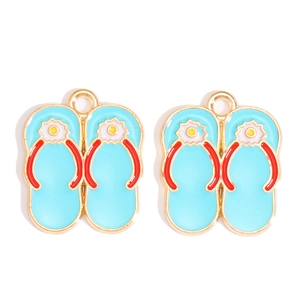 Close-up of blue alloy flip-flop charms with sunflower details and red straps for DIY
