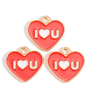 Close-up of red enamel heart charms with I Love You text for DIY jewelry making