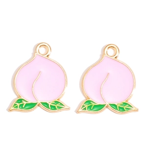 Detail van roze perzik emaille bedeltjes met gouden randen voor DIY-sieraden maken