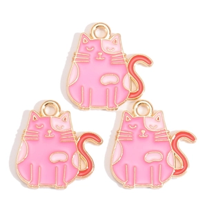 Detailed view of three cute cartoon cat pendants with pink and red enamel for DIY jewelry