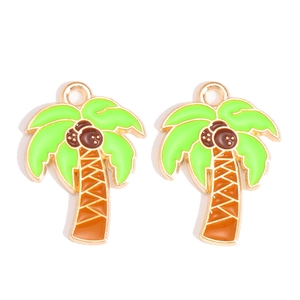 Detail view of palm tree enamel charms with green leaves and gold plating for DIY crafts