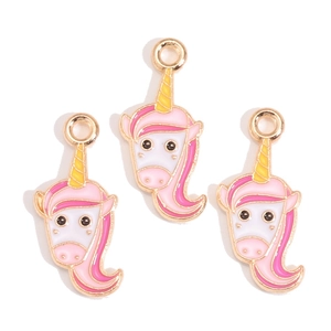 Detailed view of pink and white enamel unicorn charms with gold plating for jewelry making