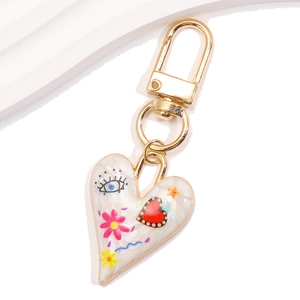 Colorful evil eye heart keychain with white marble texture and gold metal lobster clasp