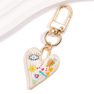 Fashion heart keychain with marble texture and colorful evil eye prints on white background