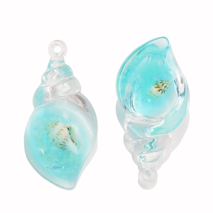 Detailed macro of translucent blue shell pendants with tiny conch and ocean sand effects