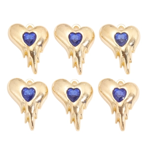 Détail de 6 pendentifs cœur lave dorés avec cristal bleu pour la création de bijoux DIY