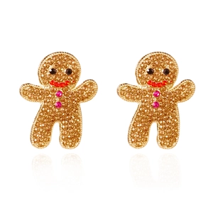 Détail de boucles d'oreilles bonhomme de pain d'épices avec strass champagne et base or