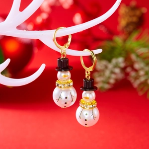 Detail of Christmas snowman earrings with white pearls and sparkling rhinestone accents