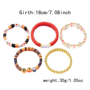 Close-up of Halloween stackable beaded bracelets showing BOO lettering and size details
