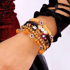 Halloween beaded bracelet set with BOO letters pumpkin skull charms on wrist