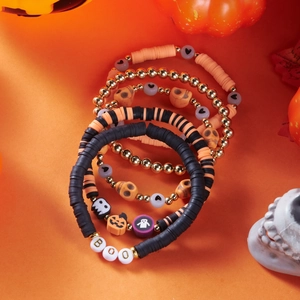 Five-piece Halloween stretch bracelet set with orange pumpkin and skull charms