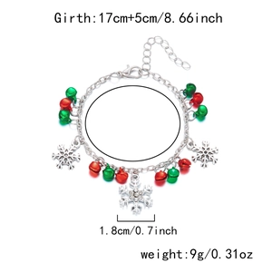 Detailed view of Christmas bracelet showing silver chain, bells, and 1.8cm snowflake pendant