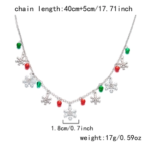 Detailed view of Christmas necklace with crystal snowflake pendants and colorful bells