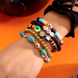 Halloween stackable bracelet set with pumpkin, ghost, skull charms and BOO letter beads