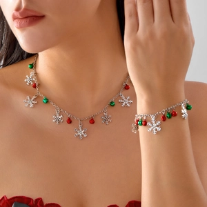 Christmas jewelry set featuring rhinestone snowflake pendant and colorful bells on model