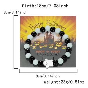 Detail of Halloween beaded bracelet featuring a white ghost charm on a themed card