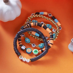 Detail of Halloween beaded bracelet set with ghost, pumpkin charms and BOO lettering